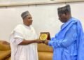 *(L-R) Ambassador Okafor mni presenting a souvenir to his host, His Excellency, Mallam Yahaya Abdulkarim OON mni.