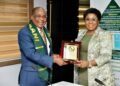 *Mrs. Esther Didi Walton-Jack OON mni, the Head of the Civil Service of the Federation (r) receiving an AANI plaque from the president, Ambassador Emmanuel Okafor (l).