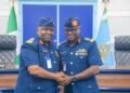 Former DOPRI AVM Edward Gabkwet (l) and his successor, Air Commodore Olusola Akinboyewa (r) in warm handshake