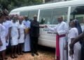 •Mr. Peter Obi presenting the key to a coaster bus to Bishop Anthony Adaji, donated to Grimard School of Nursing Science, Anyigba, Kogi State, to aid their accreditation efforts.