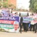 Alleged $5m Tuition: Protesters on Daily Sit-out at CCB, ICPC on Day 8 – Demand Immediate Sack, Prosecution of NMDPRA Boss